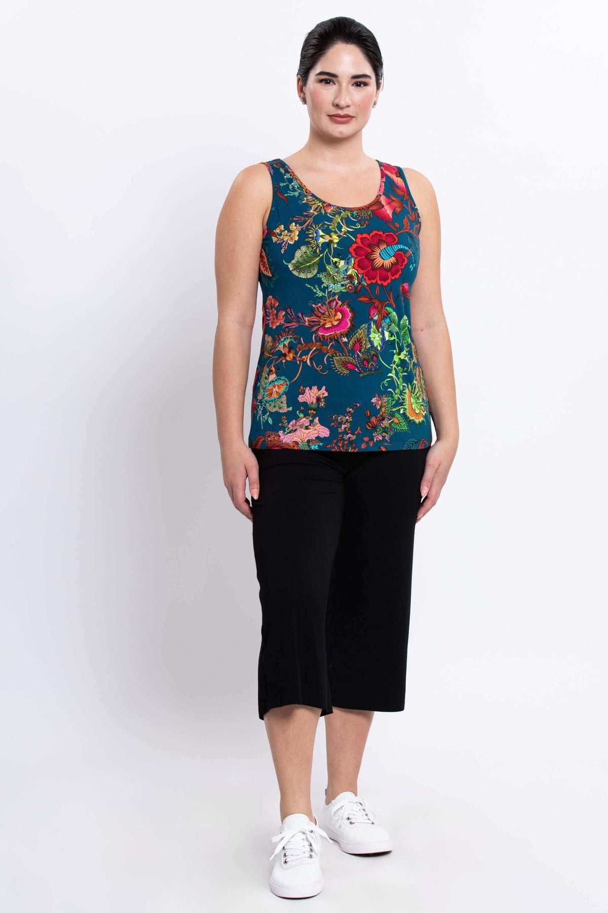 Full body view of woman in floral bamboo tank top and black pants