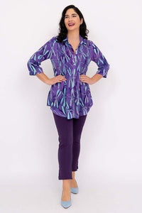 Full body view of model posing in Cindy violet dragonfly smocked blouse and purple pants