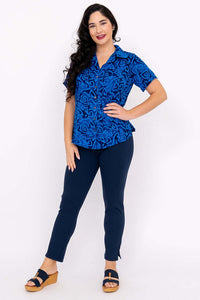 Full body view of woman modeling Aida Top with navy pants and sandals