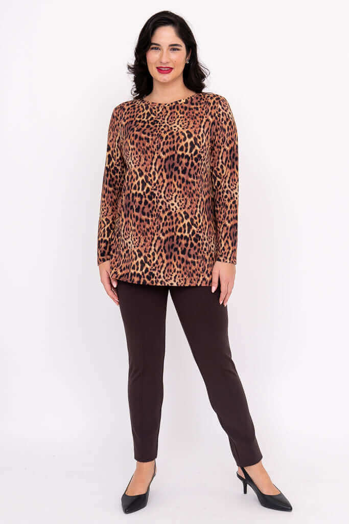 Full body image of a woman modeling a leopard print long sleeve top