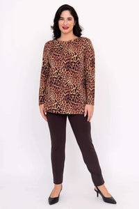Full body image of a woman modeling a leopard print long sleeve top