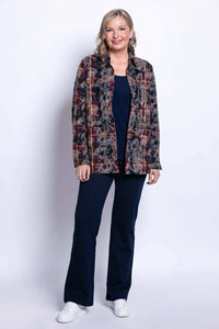 Full body shot of a woman in a plaid button-front cotton jacket and navy pants