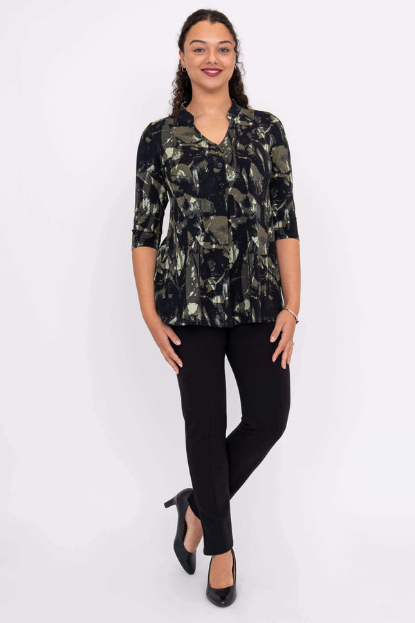 Full body view of a woman in the Edwina abstract bamboo top paired with black pants and heels
