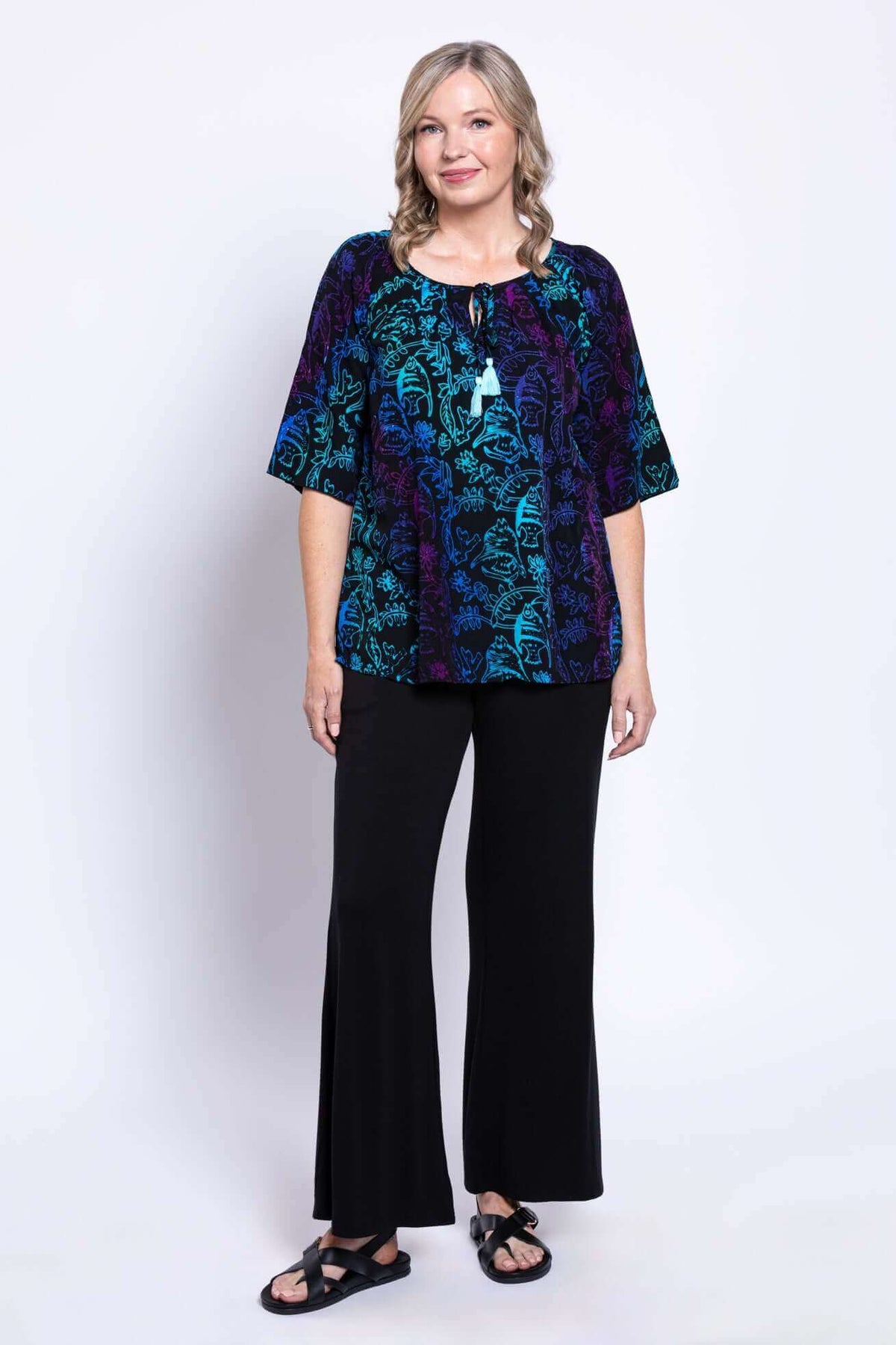 Full body view of model in Luna Boho Peasant Top and black pants