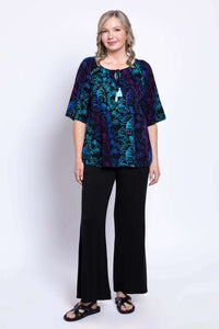 Full body view of model in Luna Boho Peasant Top and black pants