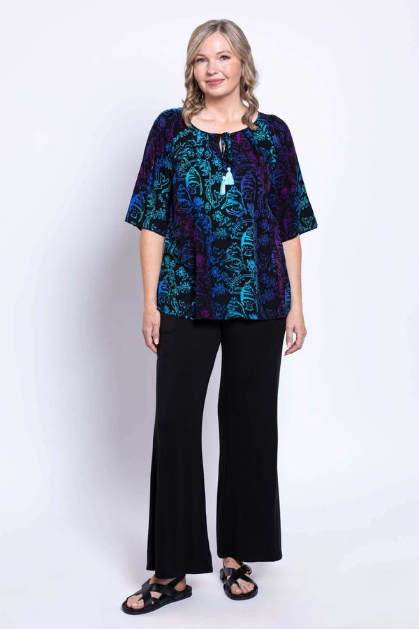 Full body view of model in Luna Boho Peasant Top and black pants