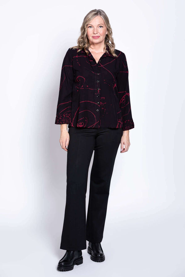 Full body view of woman wearing Ketut blouse and black pants