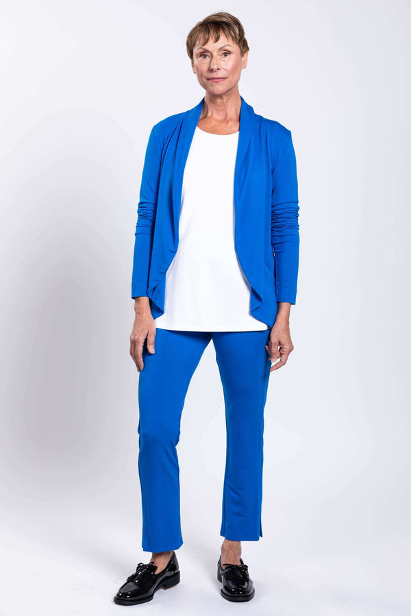 Full front view of a woman modeling an azure blue French Terry jacket and matching pants