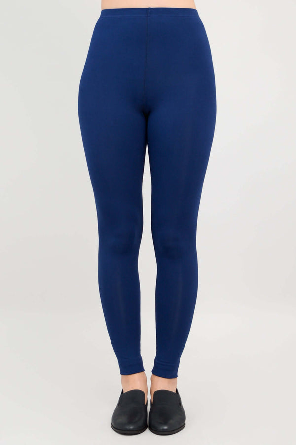 Full front view of Ruby leggings in deep blue on a model
