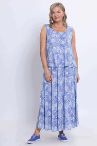 Full front view of woman wearing blue floral Ginny tank top and skirt