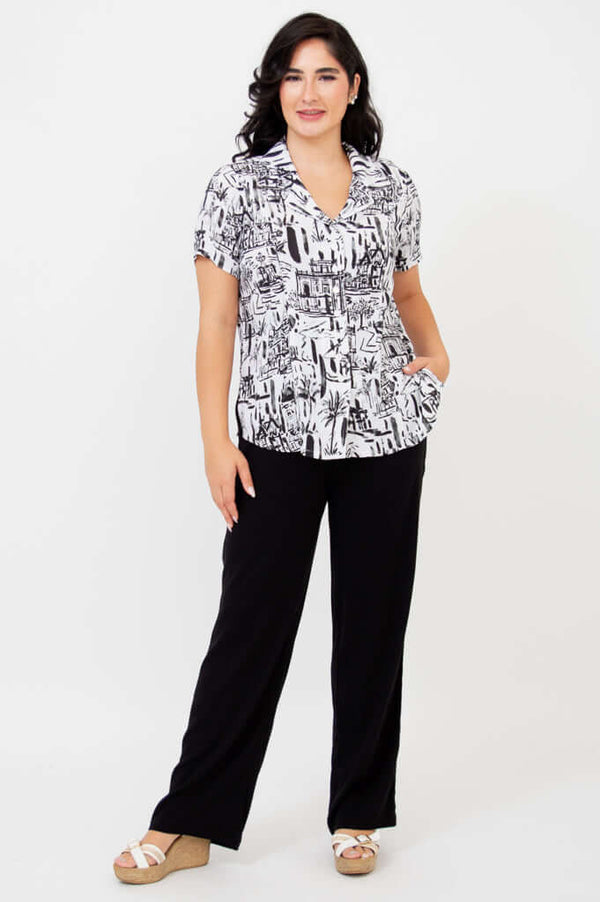 Full front view of woman in Samantha shirt with black trousers and white sandals