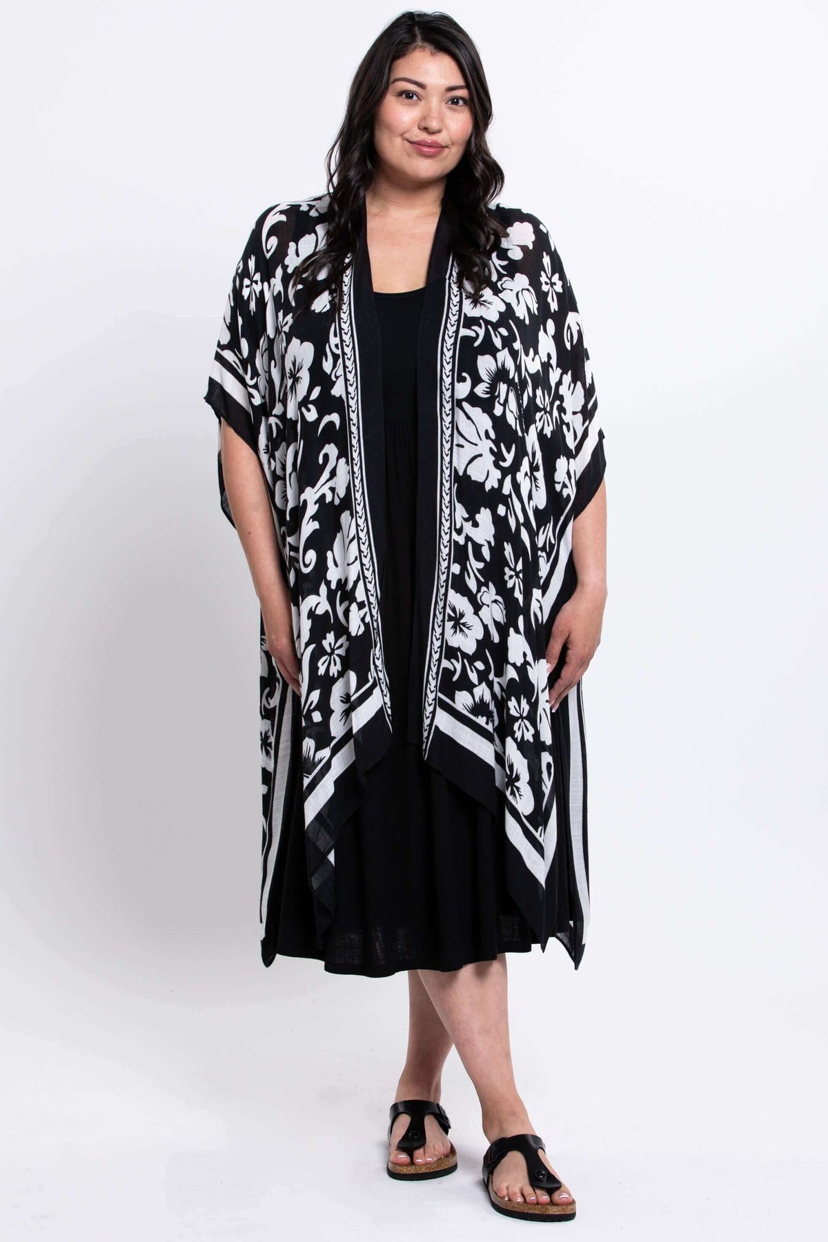 Full front view of model in black and white floral kimono wrap