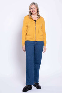 Full front view of model in wide leg jeans and yellow zip hoodie