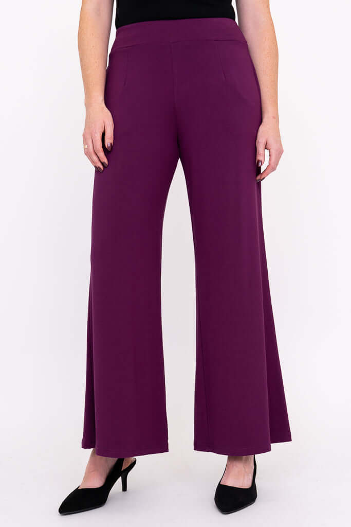 Full front view of purple wide leg pants worn with black heels