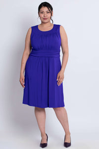Full front view of model in sleeveless ruched purple bamboo dress