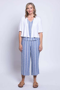 Full view of model in Landon Capri Pants, blue stripe set, and white cardigan