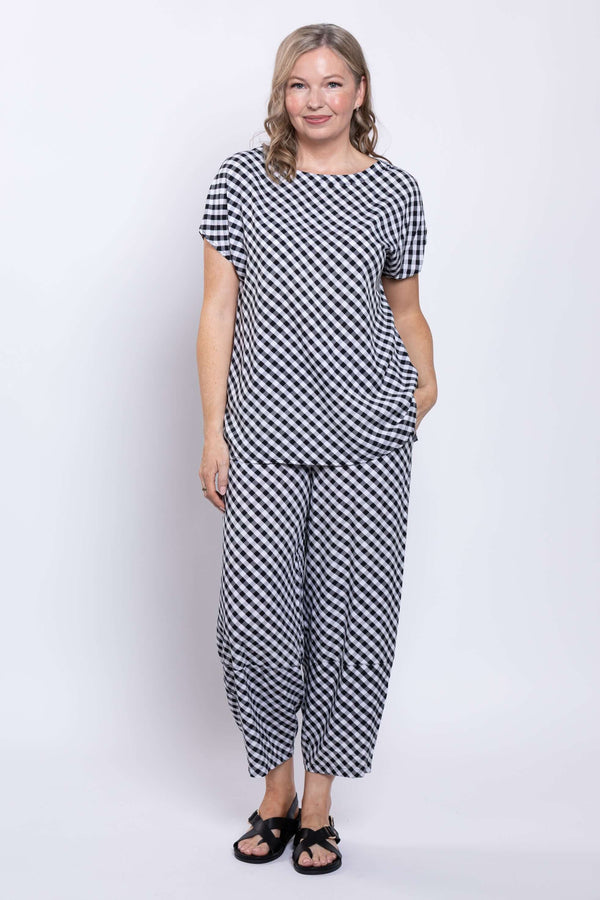 Full body view of a woman modeling a gingham linen blend top and matching pants