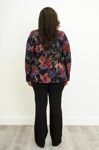 Back view of a colorful floral print bamboo top, showcasing a fluid, curved hemline and comfortable fit.