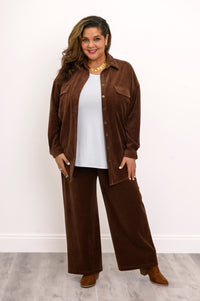 Straight-on studio shot of a women's brown button-up corduroy jacket with flap pockets and loose-fit pants