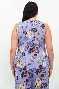 Back view of the Ginny Tank, highlighting lavender floral print and peplum