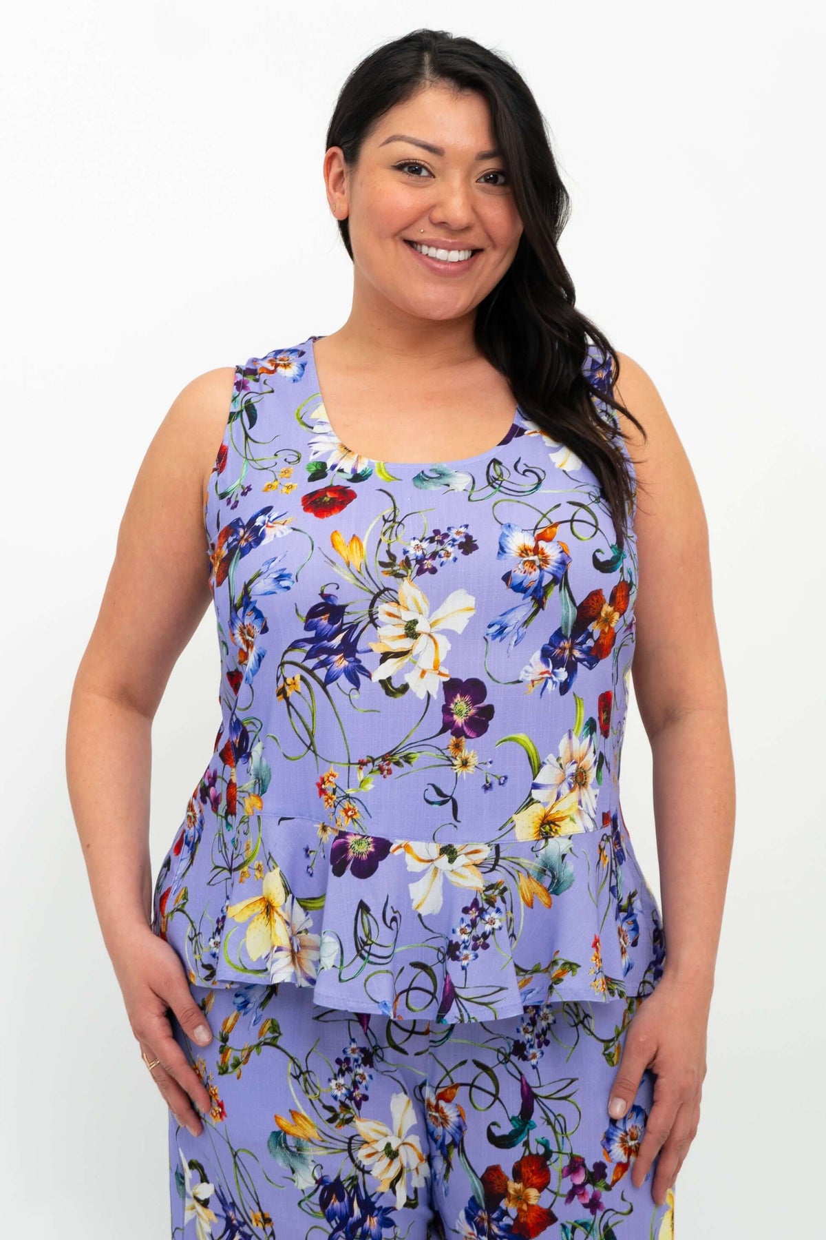 Closeup of model wearing the Ginny Tank in lavender floral bamboo linen