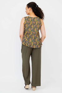 Rear view of model wearing Ginny Tank showing full back and peplum hem detail
