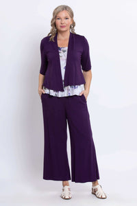 Model wearing Ginny Tank underneath purple open cardigan and matching pants
