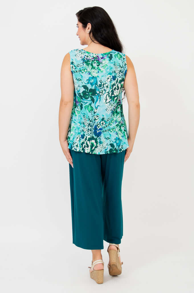 Back view of woman wearing Ginny Tank in teal floral print