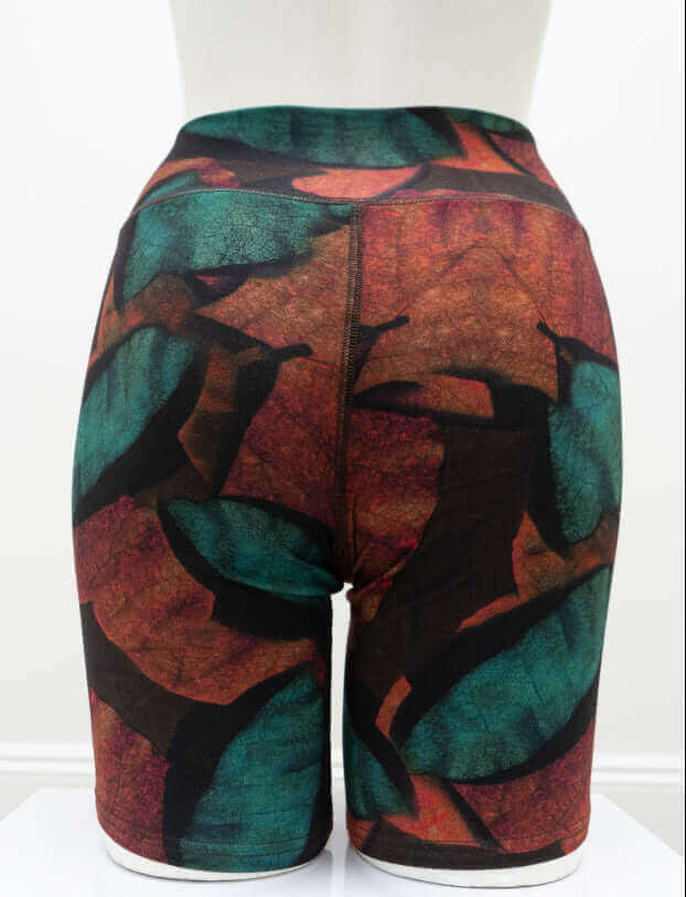Back view of Hallie Bamboo Shorts in vibrant green and rust leaf pattern