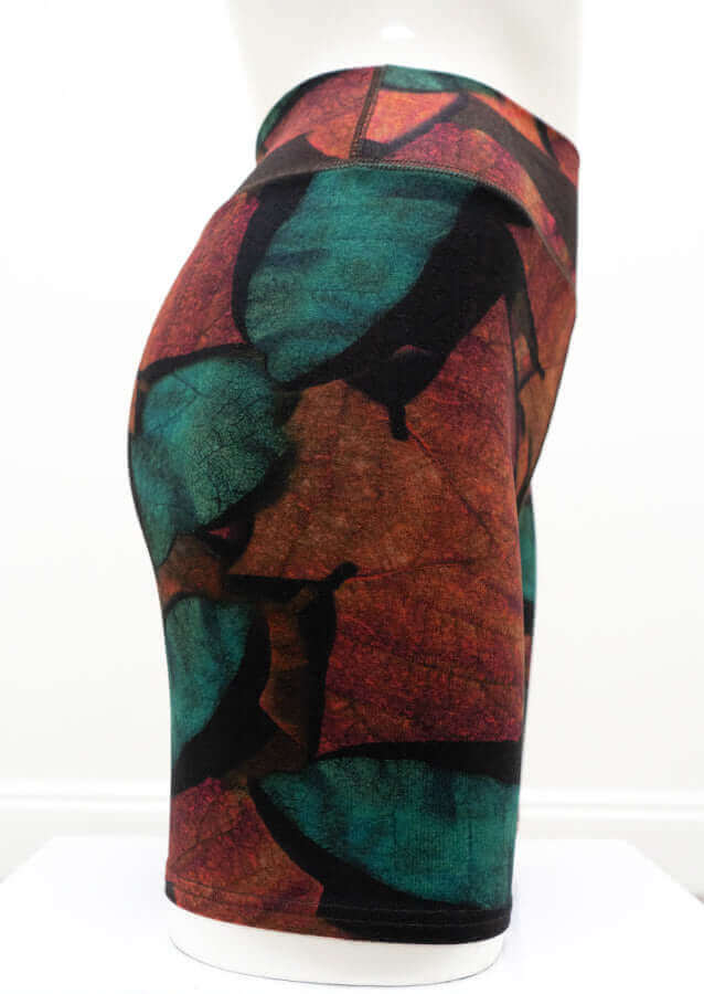 Side view of Hallie Bamboo Shorts with multicolor leaf print on a mannequin