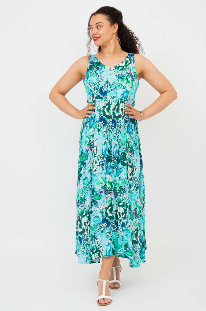 Model in Coraline aqua floral maxi dress with hands on hips, front view