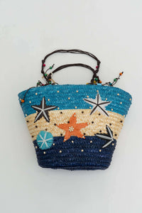 Handwoven rattan tote bag in blue, beige, and navy with colorful star and bead accents