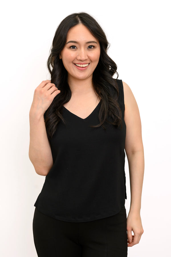 Front view of a woman wearing the Havana Tank in black linen bamboo fabric with a V-neckline.