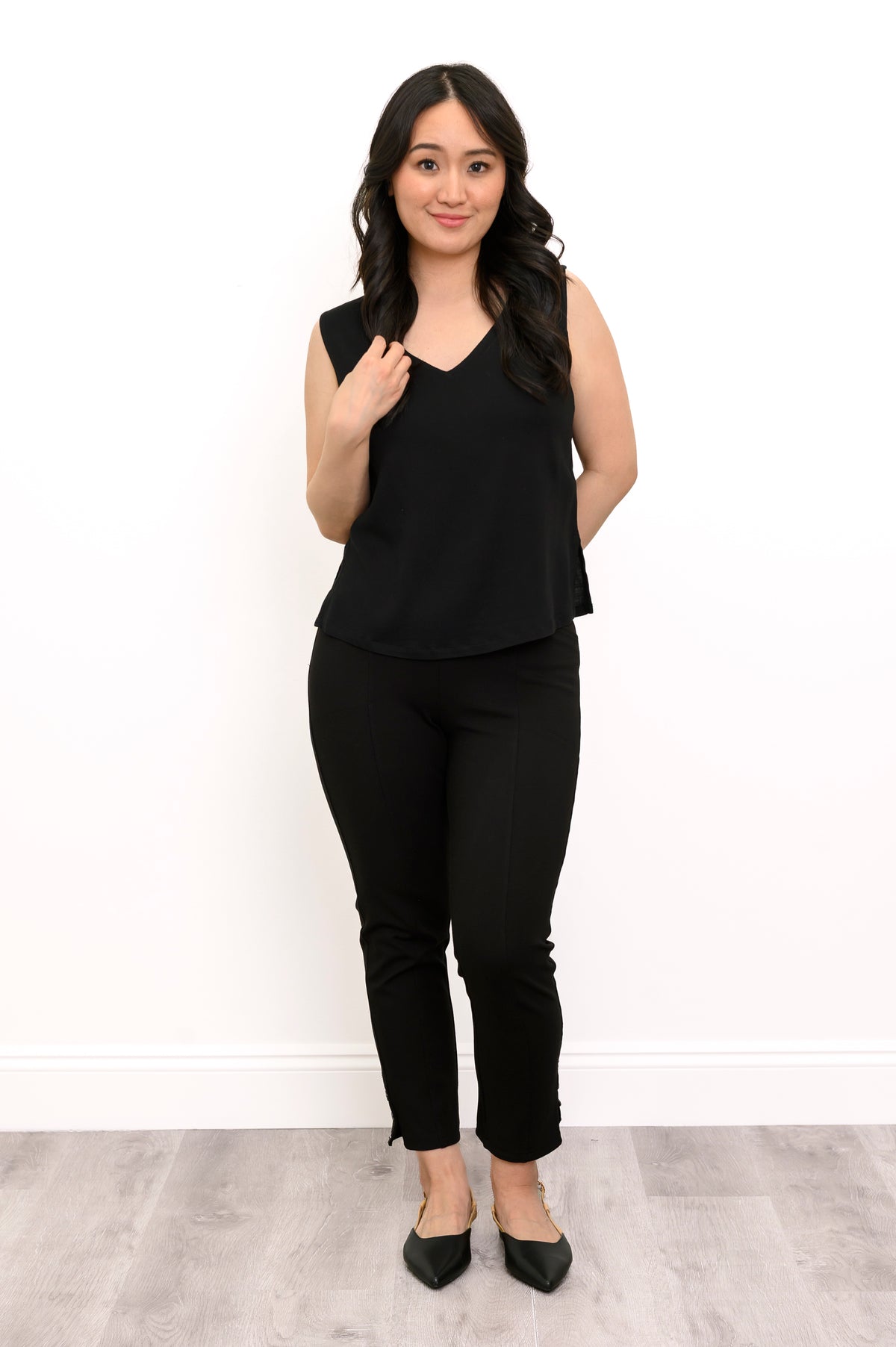 Woman wearing a black Havana Tank in linen bamboo fabric.