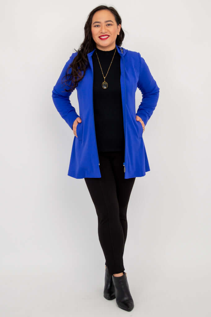 Model standing with Highlands Coat open, displaying sleek modern fit