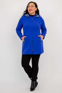 Front view of Highlands Coat zipped up with hands in pockets