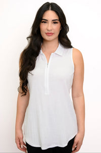 Close up of woman wearing a white sleeveless top with collar and zipper detail