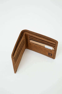 Interior of slim brown leather wallet showing card slots and logo