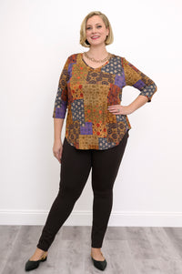 Side view of a flowy yellow geometric print bamboo blouse with 3/4 sleeves and a gentle A-line silhouette.
