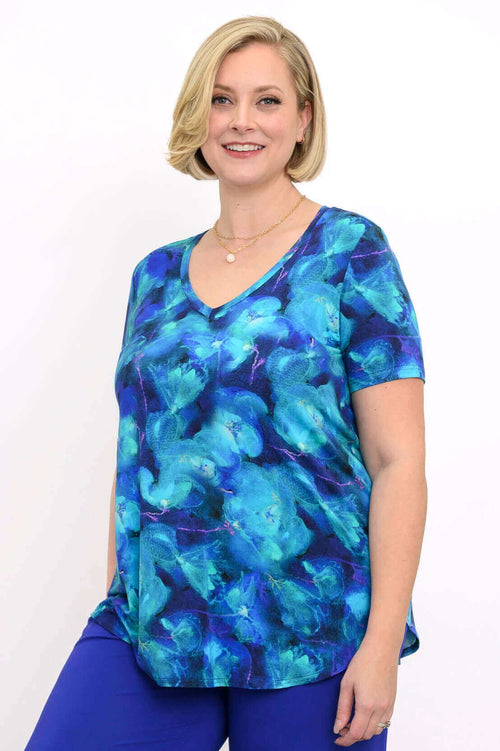 Model wearing a Jackie Bamboo V-Neck Top in Blue Water Lily print, front view