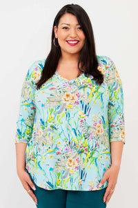 Model wearing Jackie V-Neck Bamboo Top in Spring Meadow print, smiling