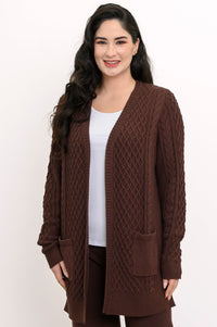 Studio portrait showcasing a dark brown open v-front cable knit sweater with long sleeves.