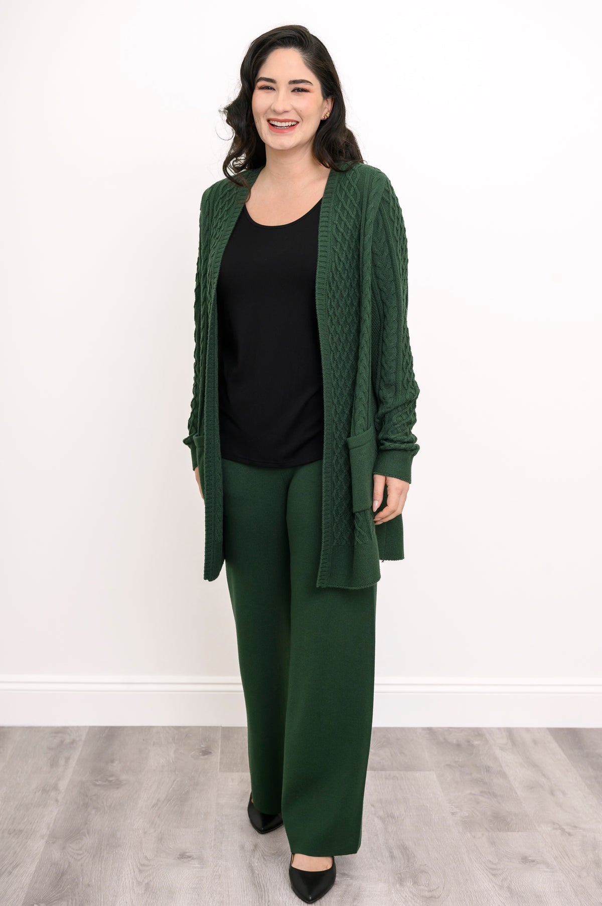 Women's casual dark green lounge pants worn with a coordinating long cardigan as a matching set, front-facing.
