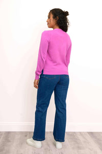 Back view of pink button-up cardigan, showing ribbed details and side slits