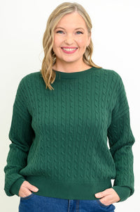 Women's long-sleeve knit top in a vibrant dark green hue with a round neck, styled against a white backdrop.