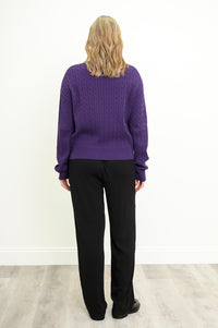 Rear view of a textured plum cotton pullover, highlighting its classic fit and comfortable mid-hip length.