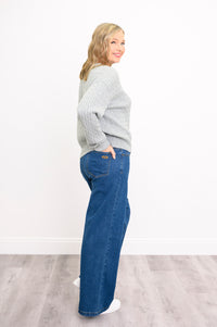 Rear view of a textured dove gray cotton pullover, highlighting its classic fit and comfortable length.