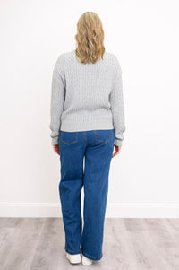 Back view of a women's silver-toned long-sleeve pullover top, showcasing a loose and comfortable frame.