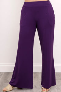 Close-up view of loose-fit royale purple bamboo knit pants highlighting a smooth waistband.