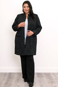 Woman wearing black textured coat with pockets and black pants on a white background, front view